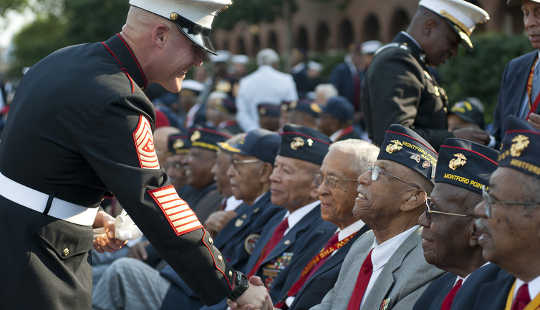 Gold medal service for black Marines who were treated unfairly in segregated boot camps. US Marine Corps