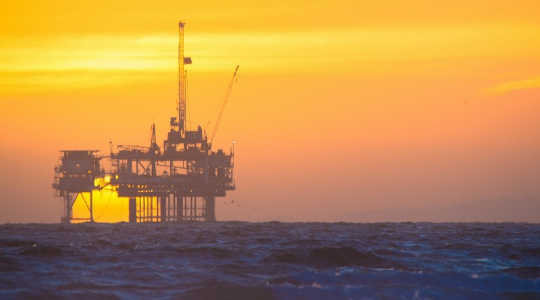  The sun sets on an offshore oil rig. Image: troy_williams via Flickr