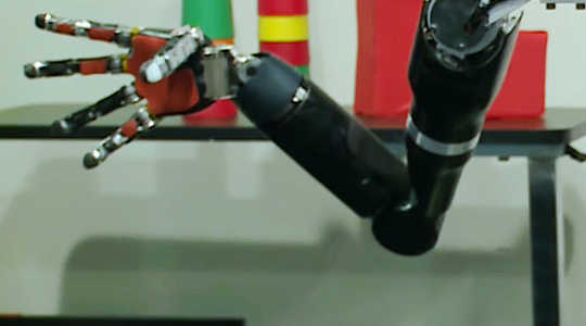 How Implants And A Robotic Arm Let A Paralyzed Man Regain Feeling