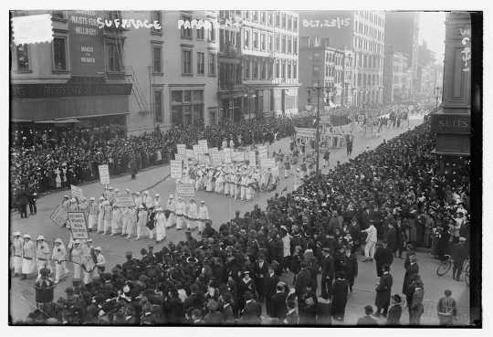 During parades, the white garments of the marchers contrasted sharply with the onlookers lining the sidewalk.