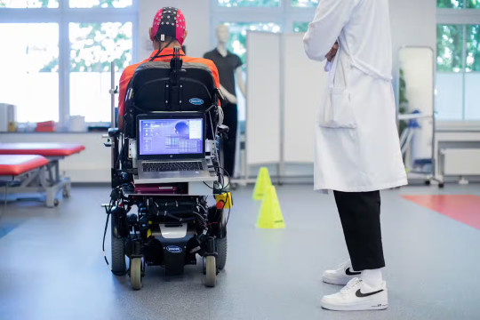 controlling a wheelchair with a robot