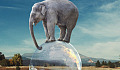 elephant balanced on the globe of planet earth