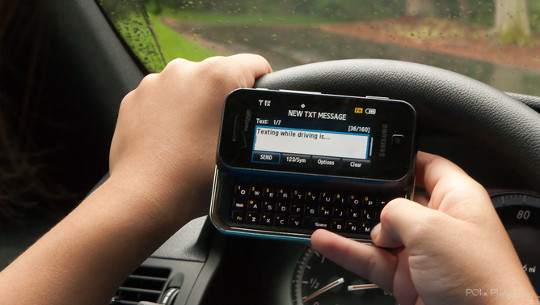  Really bad idea: texting while driving. Paul Oka/flickr, CC BY-NC