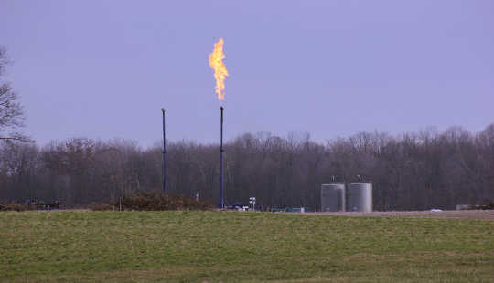 Flaring at a fracked well in northwestern Pennsylvania. One potential cause of health problems, such as asthma, in communities with fracking is higher rates of air pollution. wcn247/flickr, CC BY-NC