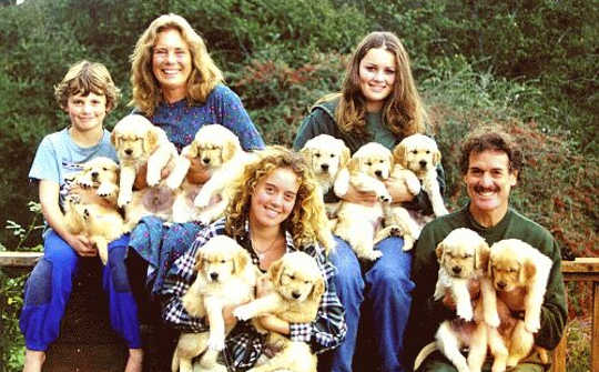 The Vissell family in 1997 with their first litter of Golden Retrievers, their family hobby.