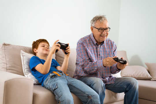 Research shows playing video games with family or friends can reduce the risk of neurodegenerative diseases such as Alzheimer’s among adults.