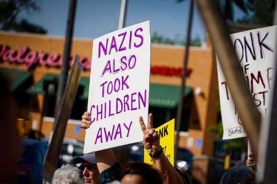 A sign from a Detroit, Michigan Keep Families Together protest (What damage are we doing to our children and ourselves?)