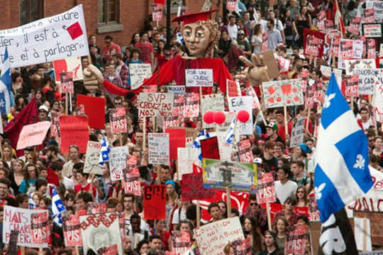 Thousands of students march through the streets of downtown Montreal in March 2012 in a massive protest against tuition fee hikes.  (why we should pay attention to the voting power of youth)