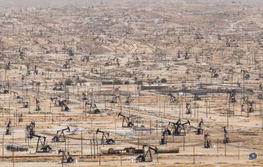 Pumpjacks dot the Kern River oil field outside Bakersfield, Calif.  (how fossil fuels are harmful in many ways and bad for your health)