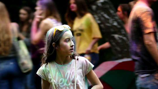 young girl in a crowd