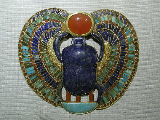 A solar scarab pendant from the tomb of Tutankhamen. (scarabs phalluses evil eyes how ancient amulets tried to ward off disease)