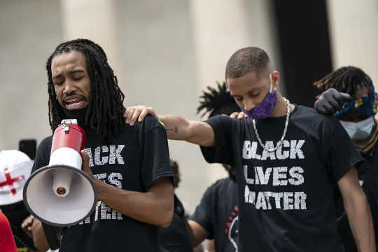 Black Lives Matter protesters pray near the Lincoln Memorial in Washington D.C.