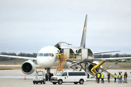 The first shipments of the COVID-19 vaccine are loaded into a UPS plane in Lansing, Michigan, on Dec. 13, 2020.