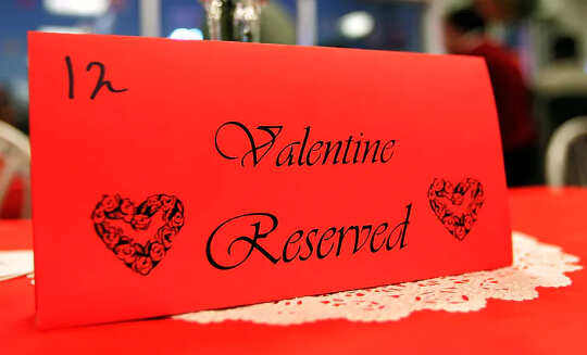 Placeholder on a restaurant holder that reads: Valentine Reserved