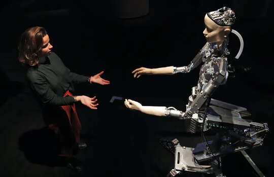 a person and an AI robot reaching out towards each other