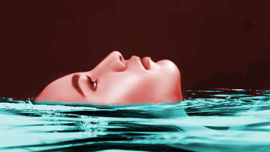 face of woman floating in water