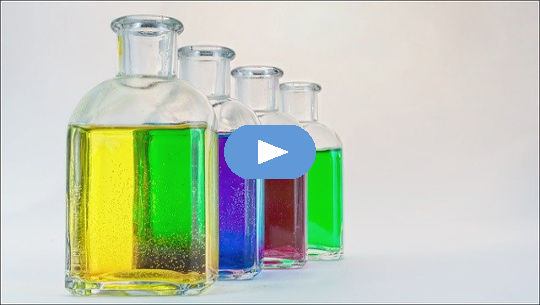 clear bottles of colored water