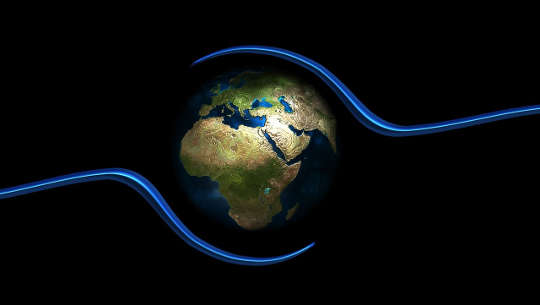Planet Earth held between an outline of two hands