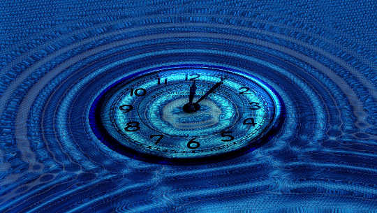 a clock in the middle of waves and ripples