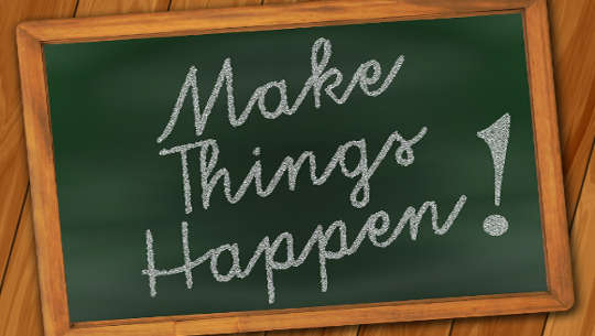 a blackboard with these words written on it: "Make it happen!" 