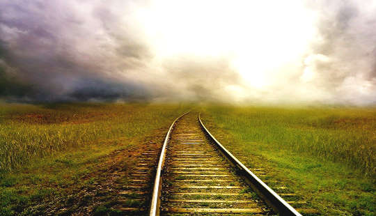 railroad tracks leading off into the distant horizon