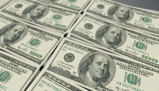 stacks of  US one-hundred dollar bills