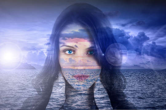a transparent woman's face with the horizon in the background