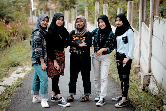 young Muslim women in jeans. skirts, leggings, and other "modern" clothing