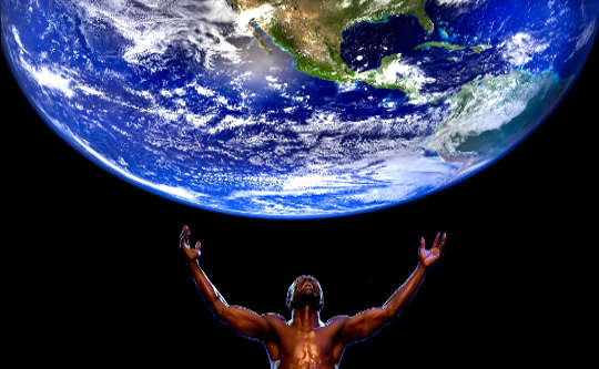 a man with arms outretched under a globe of Planet Earth