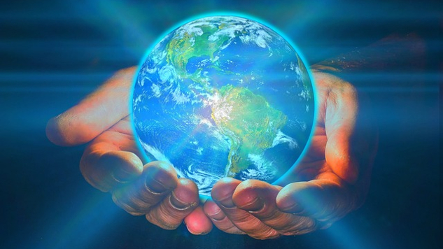 two hands holding Planet Earth