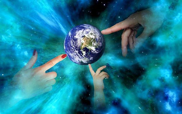 globe of Planet Earth with hands reaching out to touch it