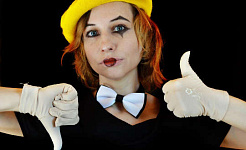 a young woman wearing a bow tie and a clown face with white gloves giving a thumbs up and thumbs down