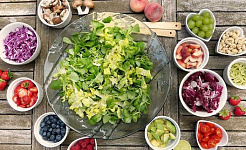 salad with small bowls of raw ingredients