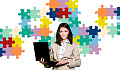 woman holding a laptop with a background of puzzle pieces on the wall behidn her