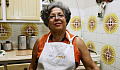 older person of color in 70s-style kitchen