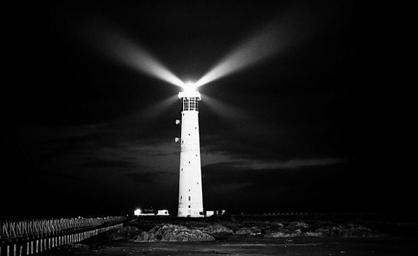 lighthouse sending a bright light in all directions