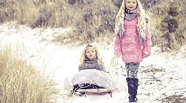 two siblings in the snow