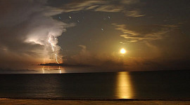 Lightning and the Moon. Photo by Marc-André Besel. 